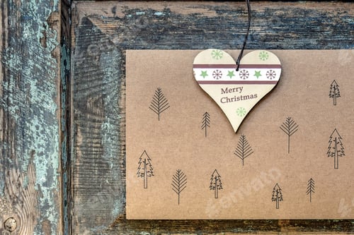 Preview: Top view of Christmas toy-heart with inscription Merry Christmas, decorative paper with image of fir