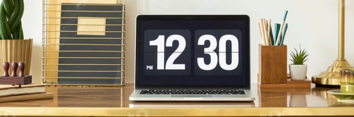 Preview: Panorama and close-up on clock on laptop desktop on wooden desk