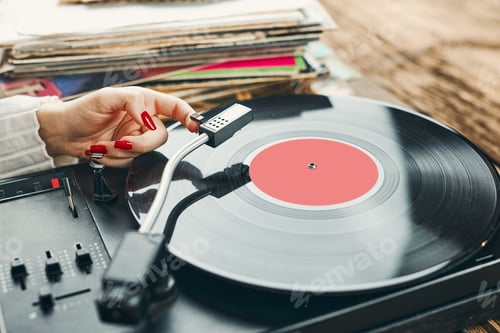 Preview: Woman listening to music from vinyl record. Playing music on turntable player. Retro vintage. Hobby