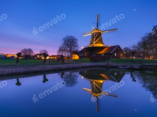 Preview: Windmill in the Netherlands. Old historical buildings. Architectural landscape.