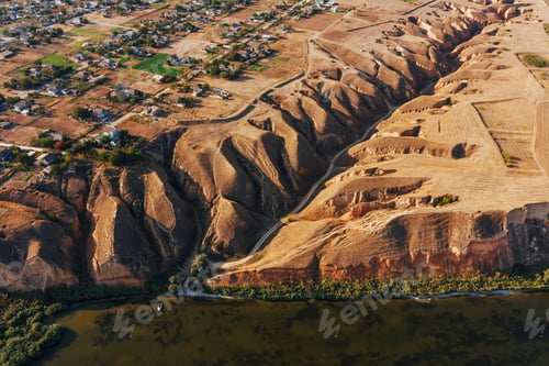 Preview: Aerial view of mountain and roads at daytime. Natural sunlight over the village buildings