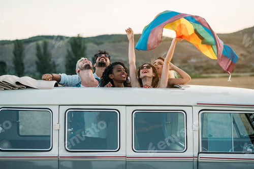Preview: People with LGBT flag in van