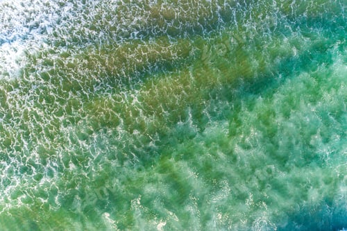 Preview: Aerial view of ocean waves on a sunny day