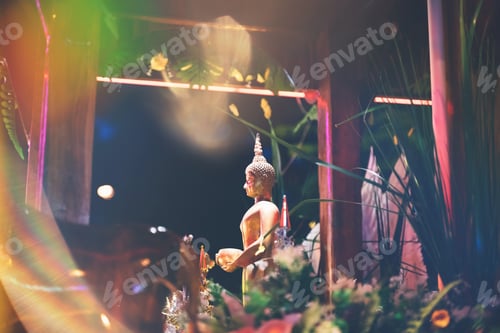 Preview: Golden Buddha statue in profile on the altar