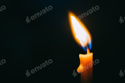 Preview: Burning candle isolated on black background. Concept for mourning sadness and sorrow