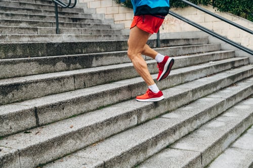 Preview: Unrecognizable senior man running up stairs