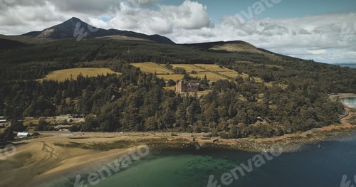 Preview: Scotland's ocean coast landscape aerial view: forests, valley, hills. Brodick castle in Arran