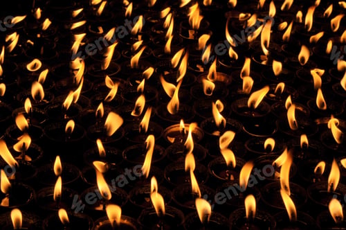 Preview: Butter lamps with flames near Bodhnath stupa in Kathmandu, Nepal