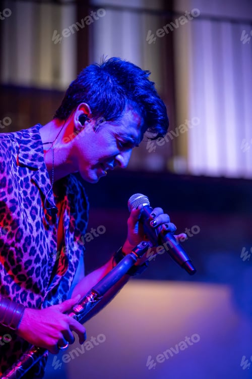 Preview: Rock and roll group performing live at night