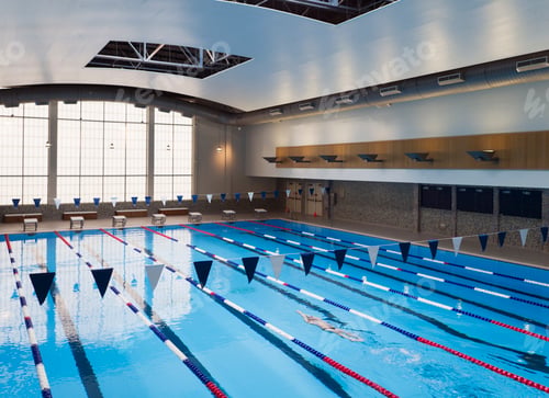 Preview: Man swimming in a indoor swimming pool.