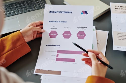 Preview: Hands of young female accountant pointing at document with chart and diagrams