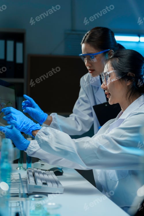 Preview: Women scientists analyzing research data in laboratory