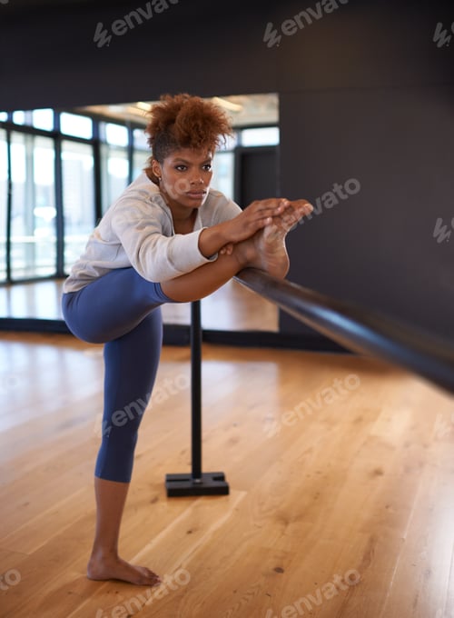 Preview: Her body is a beautiful instrument. Shot of an attractive young woman practicing in a dance studio.