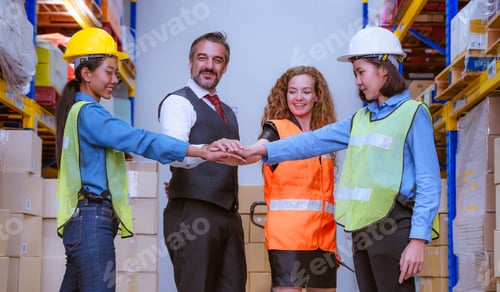 Preview: Industry manager and worker under discussion about production at factory warehouse. They wearing saf