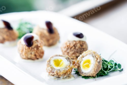 Preview: gourmet organic scotch quail eggs starter snack on table