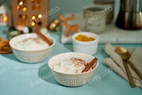 Preview: Christmas food. Rice pudding. French rice dessert. Christmas evening or night cozy light of lamp