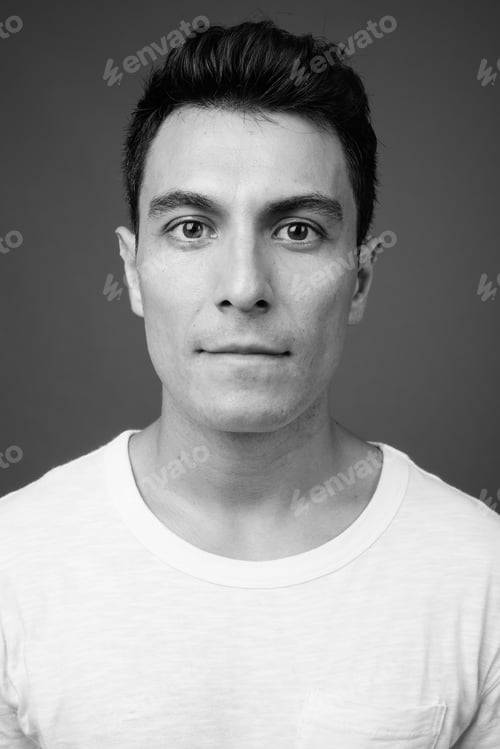 Preview: Young handsome Hispanic man against gray background