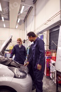 Preview: Male Tutor With Students Looking At Car Engine On Auto Mechanic Apprenticeship Course At College