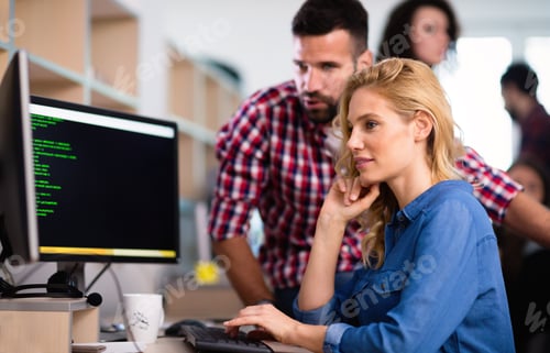 Preview: Programmers cooperating at information technology company