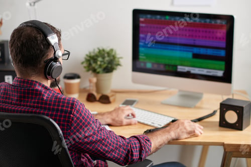 Preview: Man working at sound studio