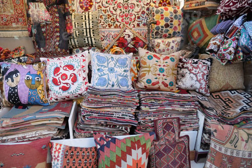 Preview: Colourful cushions on display for sale in a traditional Turkish Bazaar.
