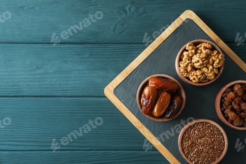 Preview: Cutting board with healthy food on wooden background, top view