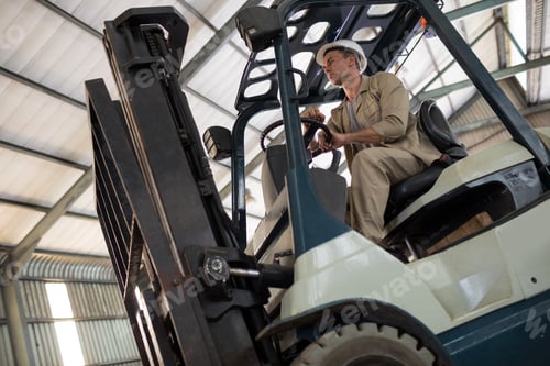 Preview: Worker driving forklift