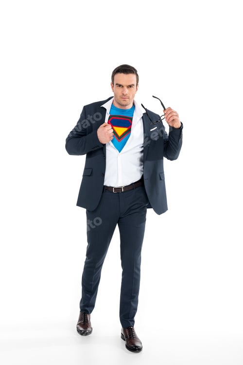 Preview: confident businessman in superhero costume under suit taking off eyeglasses and looking at camera