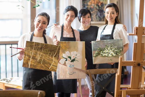 Preview: Art teacher with young women in studio