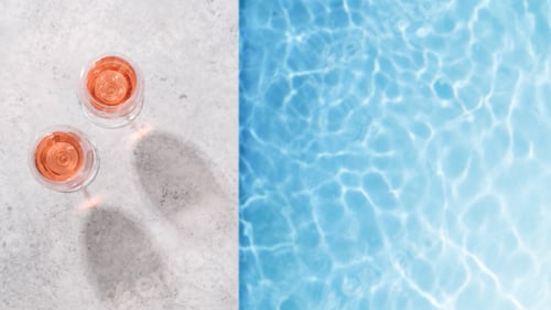 Preview: Refreshing rose wine by the pool on a sunny day