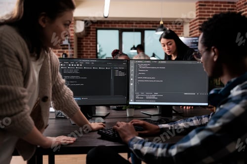 Preview: Expert programmers developing data decryption high tech software in order to save corrupted files