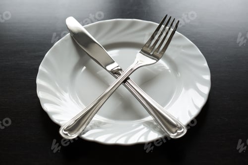 Preview: Cutlery on a black background. Fork, spoon, knife, plate.