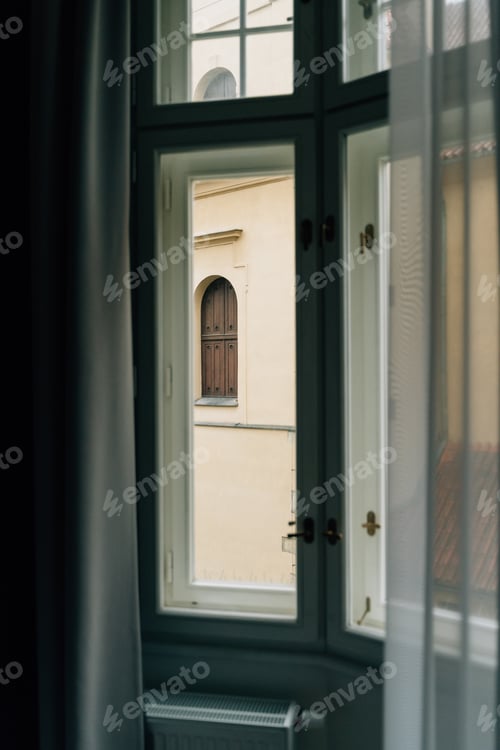 Preview: Window view from old European building in Prague