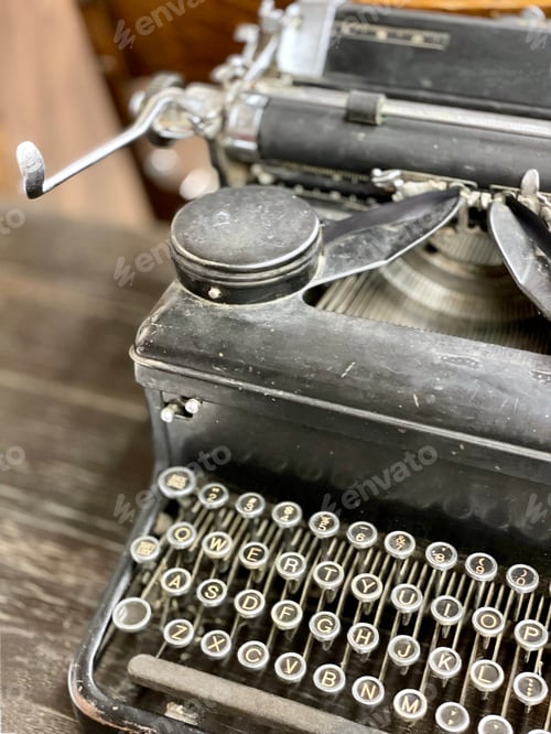 Preview: Dusty vintage manual typewriter on desk