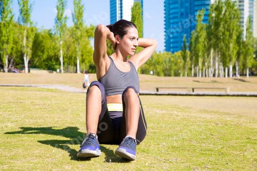 Preview: Fit young Latin woman training in the park