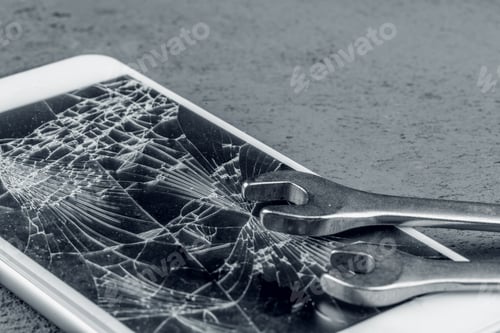 Preview: Crashed smartphone with repairing tools on grey background