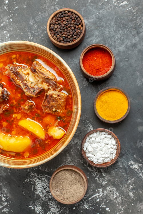 Preview: top view delicious meat soup with different seasonings on a dark background meal sauce dish photo