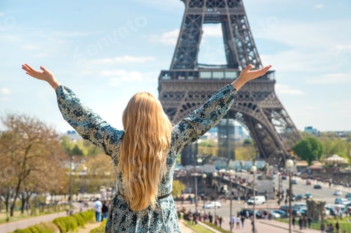 Preview: Woman near the eiffel tower. Selective focus.