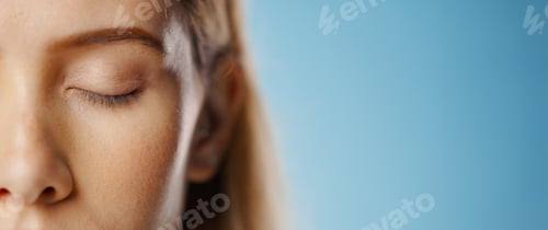 Preview: Eyeshadow, makeup and face of woman in studio for beauty, cosmetics or glamour on blue background.