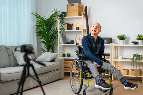Preview: Disabled man recording a video tutorial at home