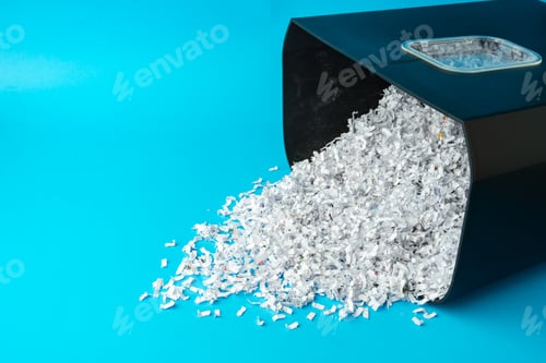 Preview: Shredded paper pieces on a blue background