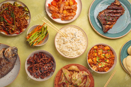 Preview: Assorted traditional chinese dishes top view on green background: kung pal chicken, sweet and sour