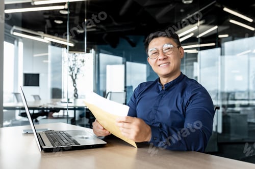 Preview: Portrait of successful businessman inside modern office building, asian man received good news news
