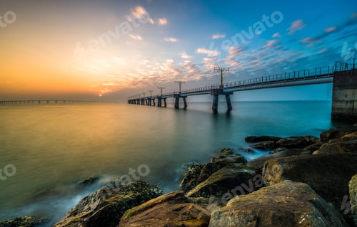 Preview: Orange sunset over a bridge in Hong Kong