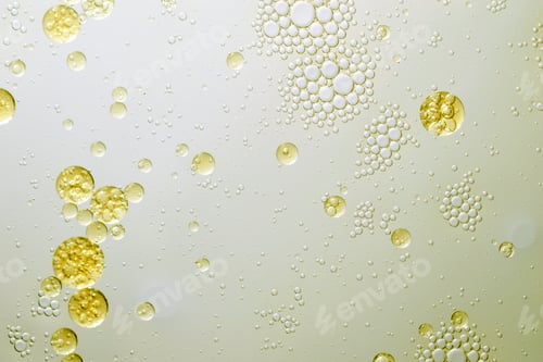 Preview: Abstract various yellow bubbles oil or skin care serum. cosmetic or spa ingredient concept