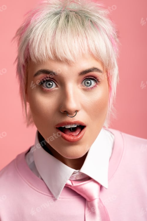 Preview: Captivating portrait of a joyful young woman with playful hair and vibrant expression