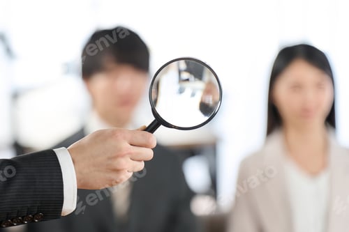Preview: Image of searching for human resources with a magnifying glass