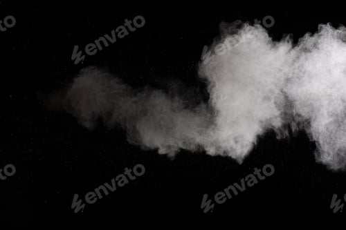 Preview: White powder explosion isolated on black background.White dust particles splash.