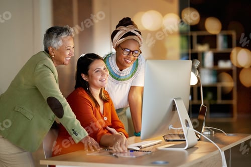 Preview: Women, business and creative collaboration on computer at night in office for teamwork, planning or
