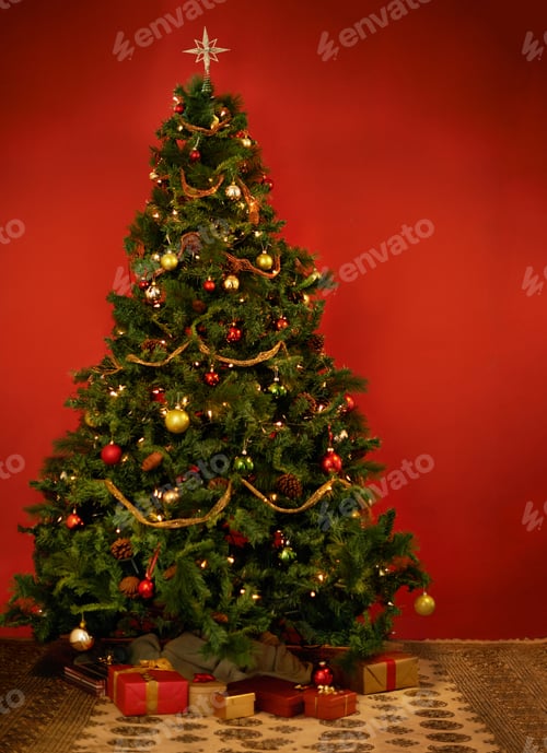 Preview: Its Christmastime. Studio shot of a decorated Christmas tree with gifts underneath it.